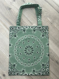 Green bandana patterned bag on a wooden surface